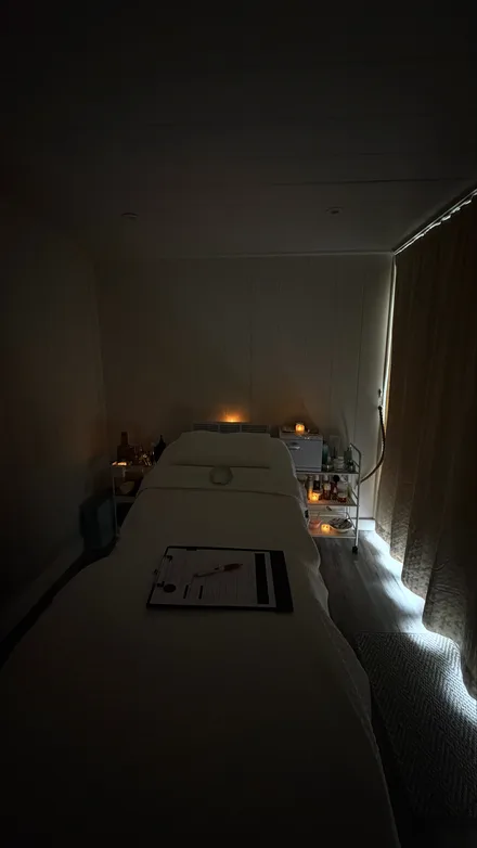 The same room after dark, lit by candles.